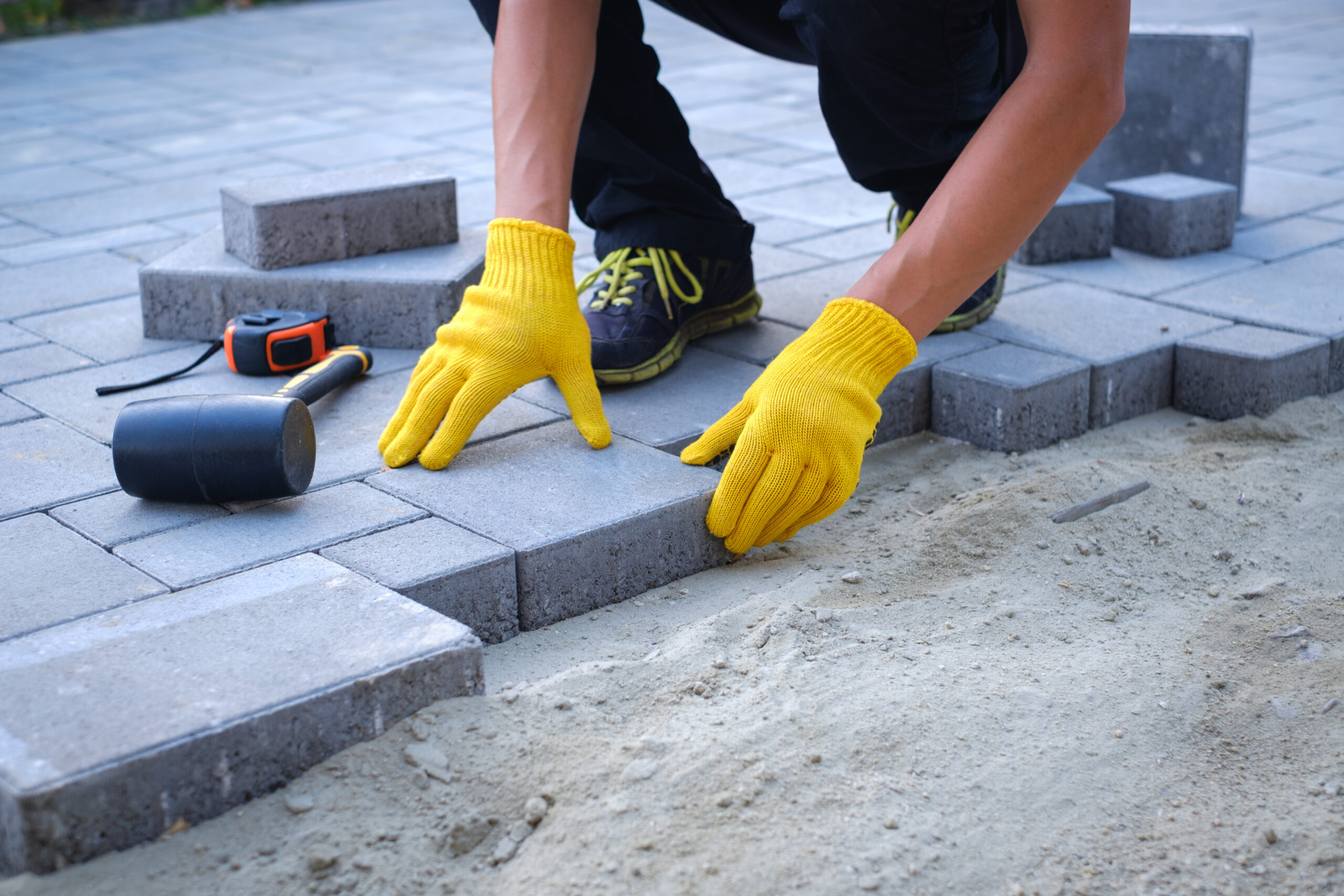 Interlocking paving stone driveway with herringbone pattern and clean edges